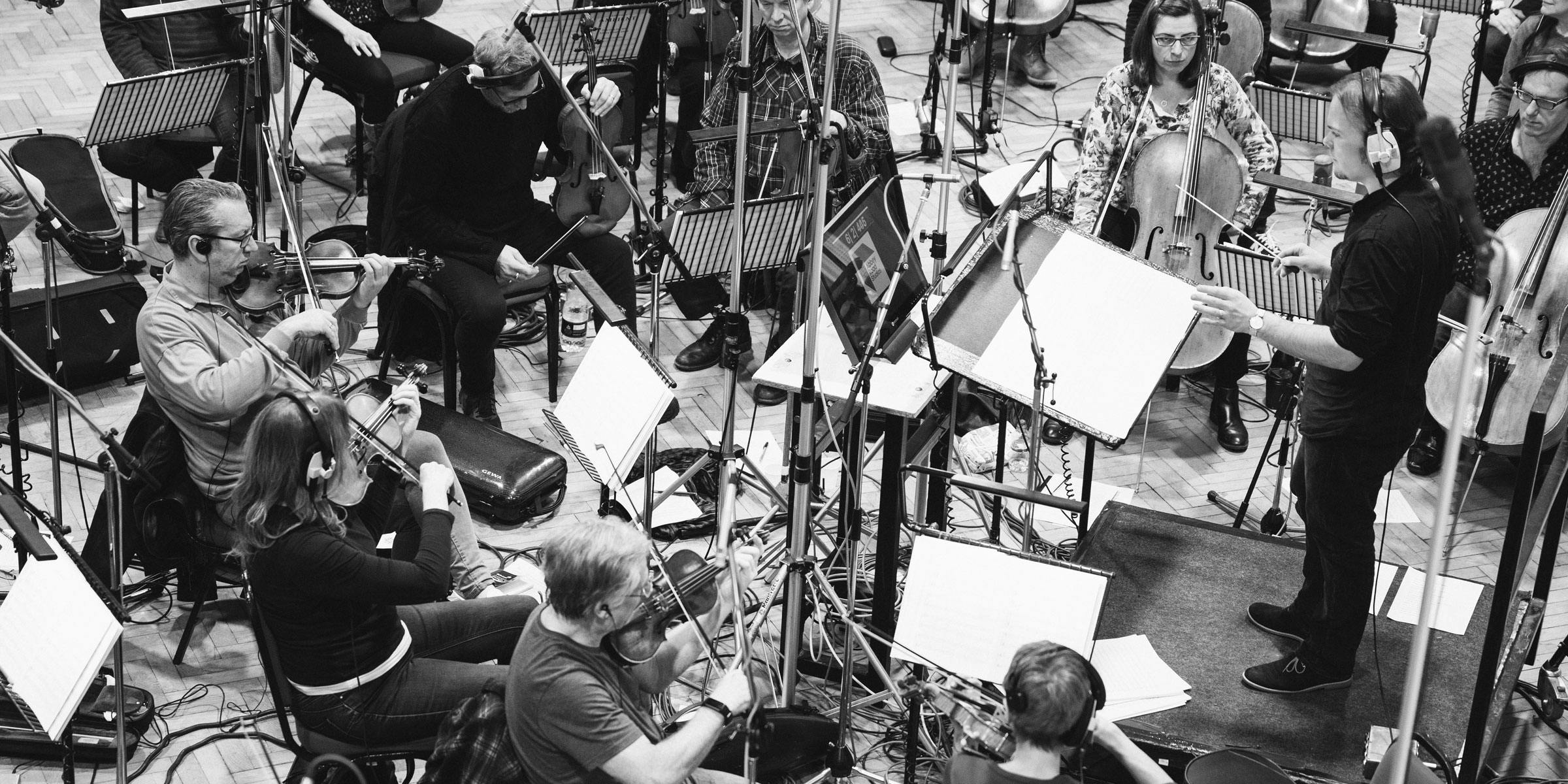 Orchestra playing violins at Abbey Road Studios